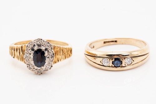 Lot 129 - A sapphire and diamond cluster rings, the oval...