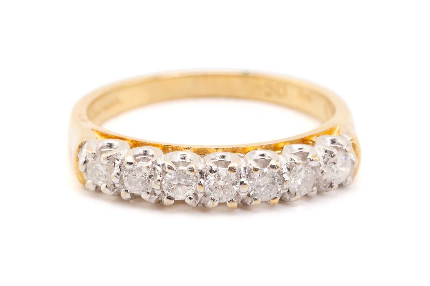 Lot 133 - A seven-stone half hoop diamond ring,...