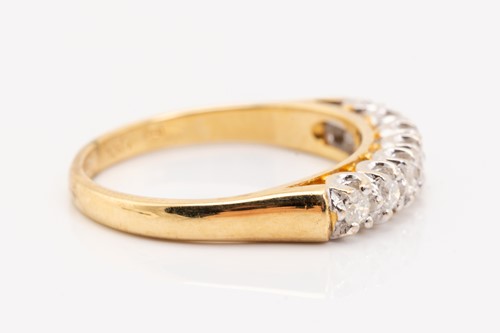 Lot 133 - A seven-stone half hoop diamond ring,...