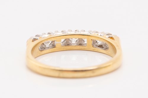 Lot 133 - A seven-stone half hoop diamond ring,...