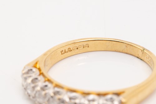 Lot 133 - A seven-stone half hoop diamond ring,...