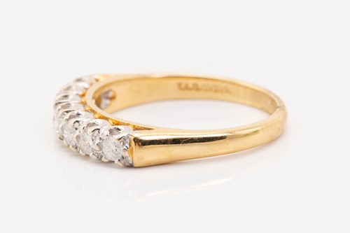 Lot 133 - A seven-stone half hoop diamond ring,...