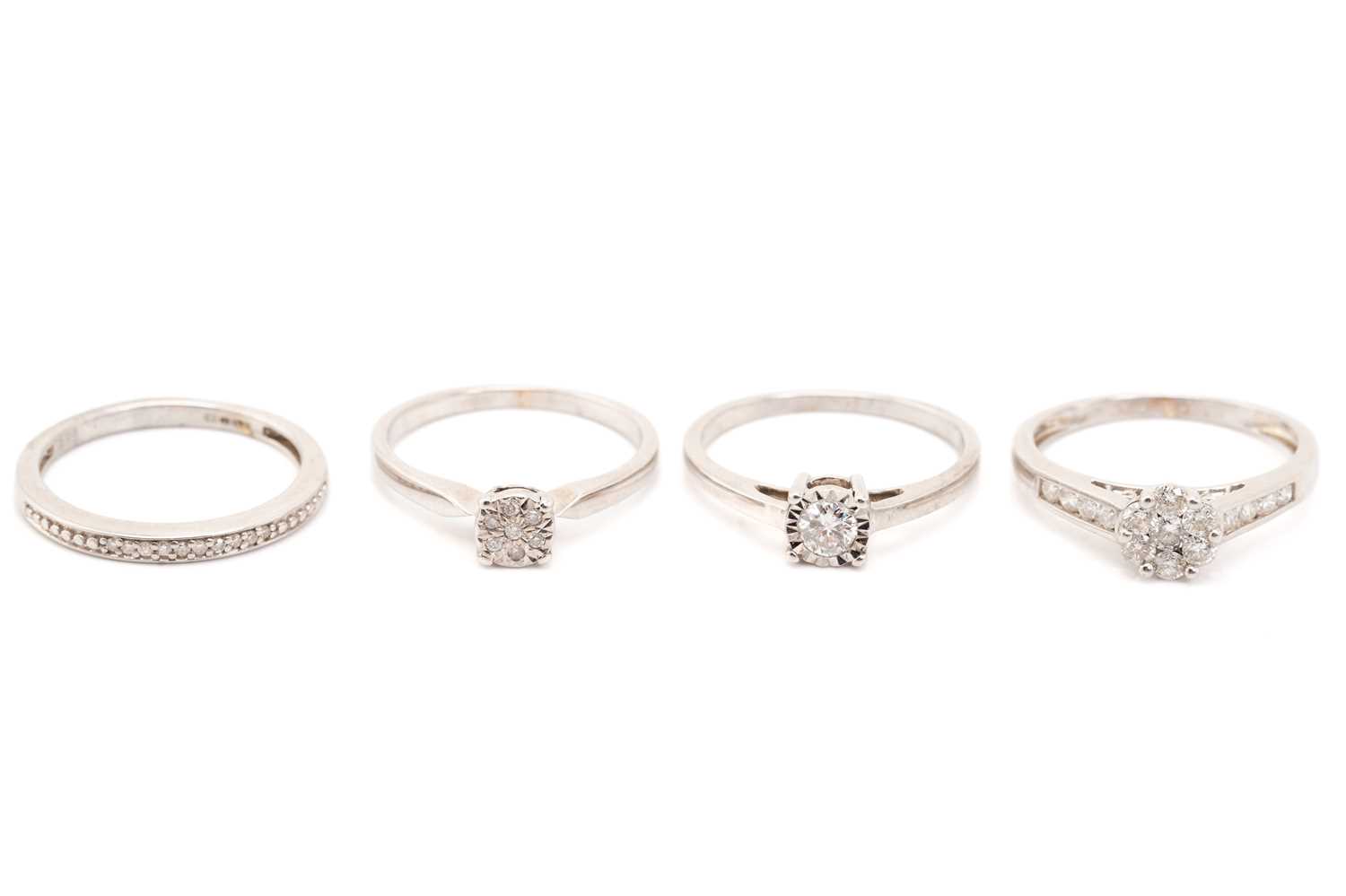 Lot 137 - A seven stone diamond cluster ring, to diamond...