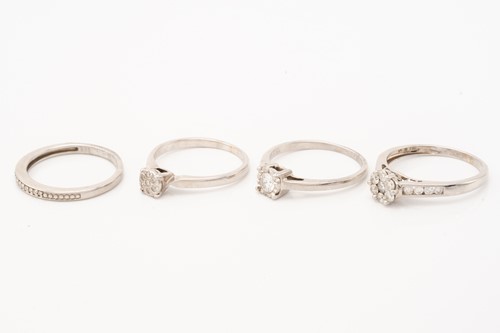 Lot 137 - A seven stone diamond cluster ring, to diamond...