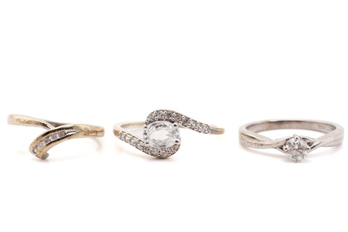 Lot 173 - Three gem-set rings in 9ct white gold;...