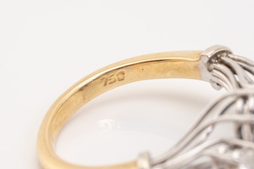 Lot 125 - A two stone sapphire and diamond ring; the...