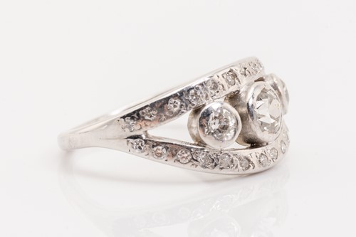 Lot 205 - A white metal bombe style diamond set ring,...