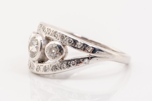Lot 205 - A white metal bombe style diamond set ring,...