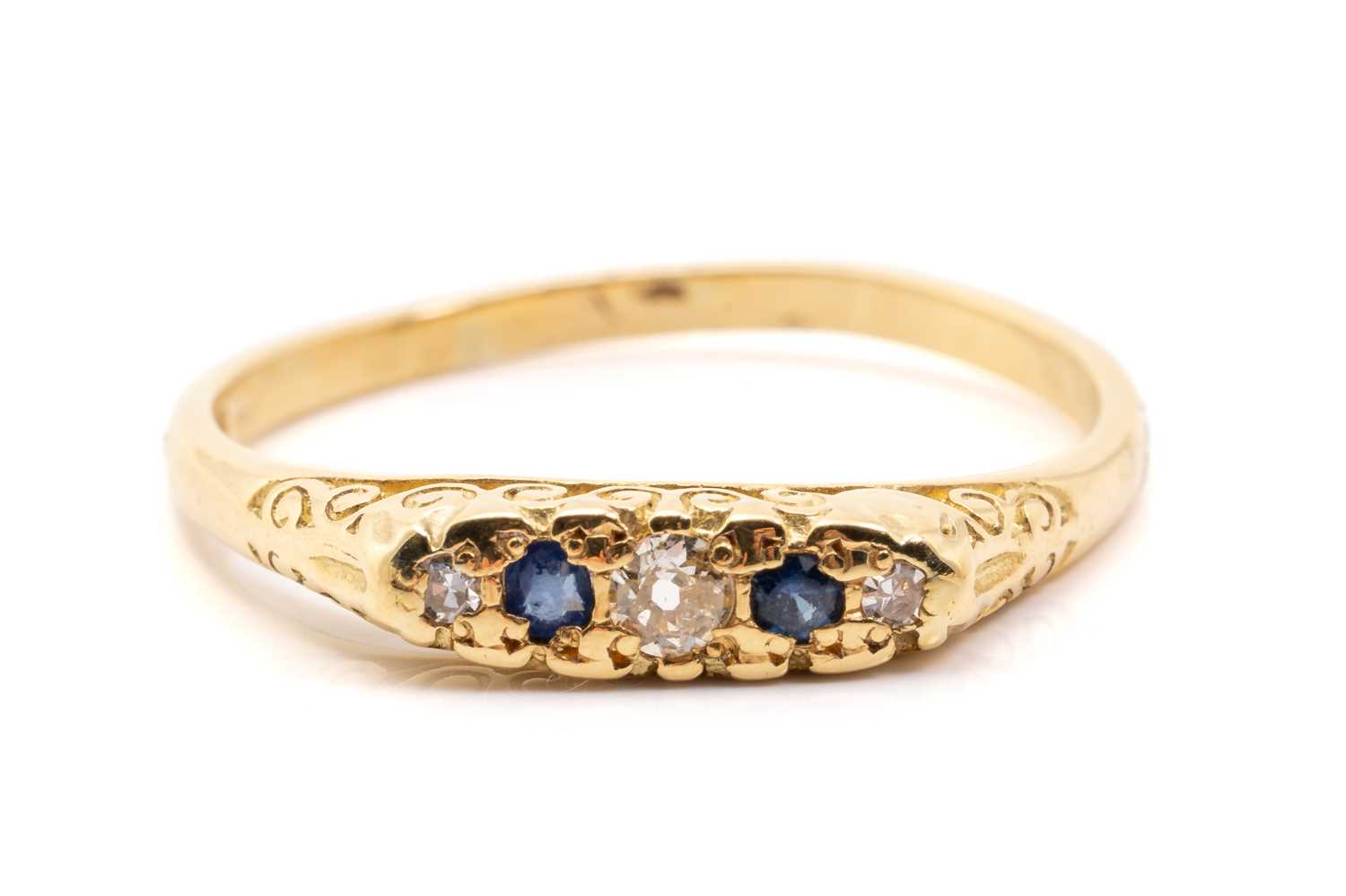 Lot 132 - An 18ct yellow gold, sapphire and diamond half-...
