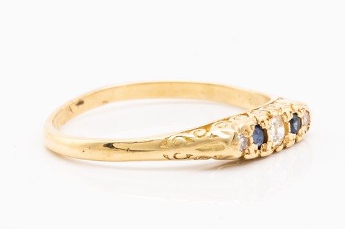 Lot 132 - An 18ct yellow gold, sapphire and diamond half-...
