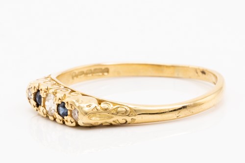 Lot 132 - An 18ct yellow gold, sapphire and diamond half-...