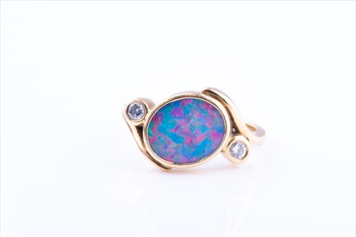 Lot 438 - An 18ct yellow gold, diamond, and opal ring of...