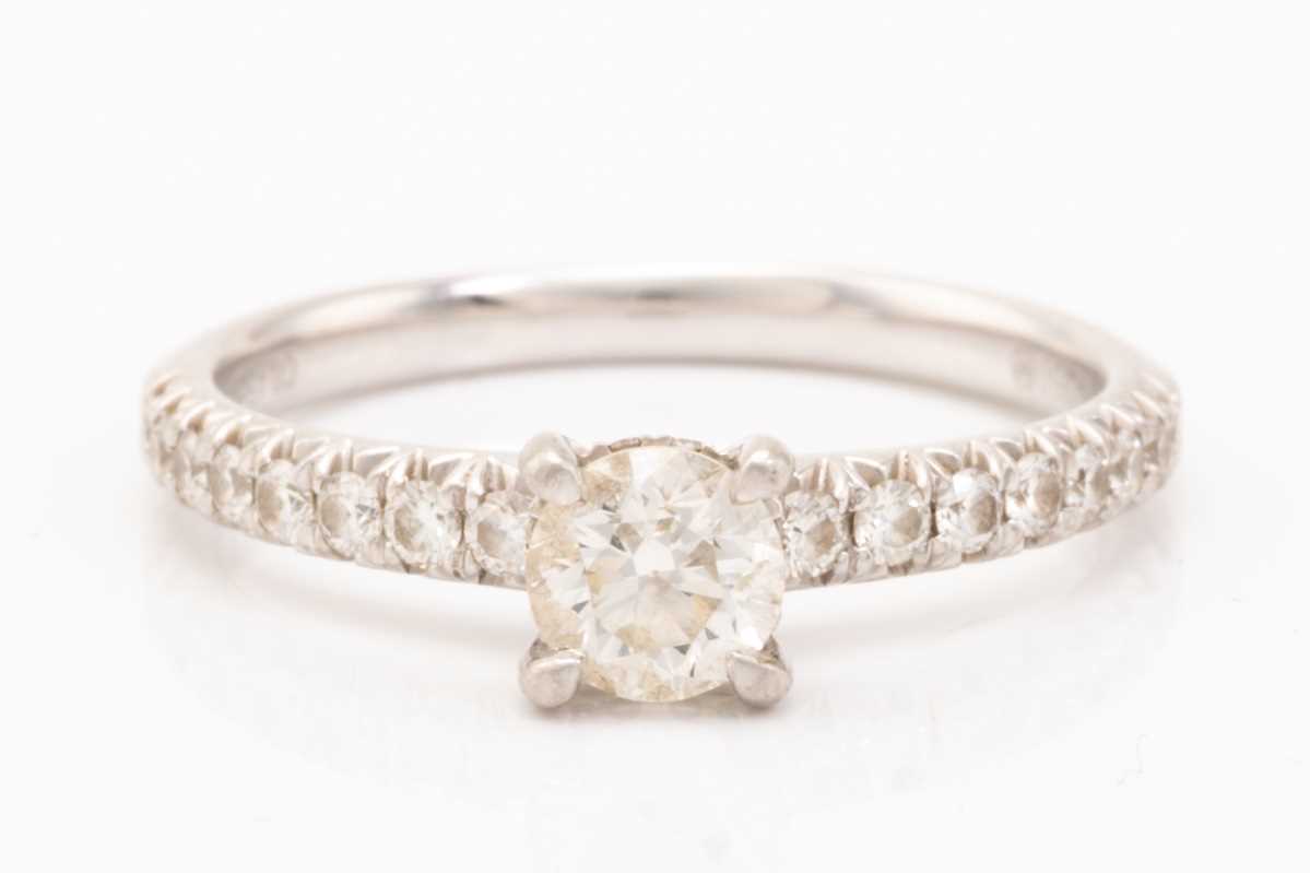 Lot 85 - A diamond solitaire ring in platinum, centred...