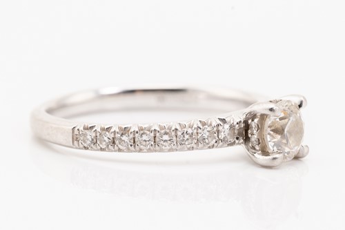 Lot 85 - A diamond solitaire ring in platinum, centred...