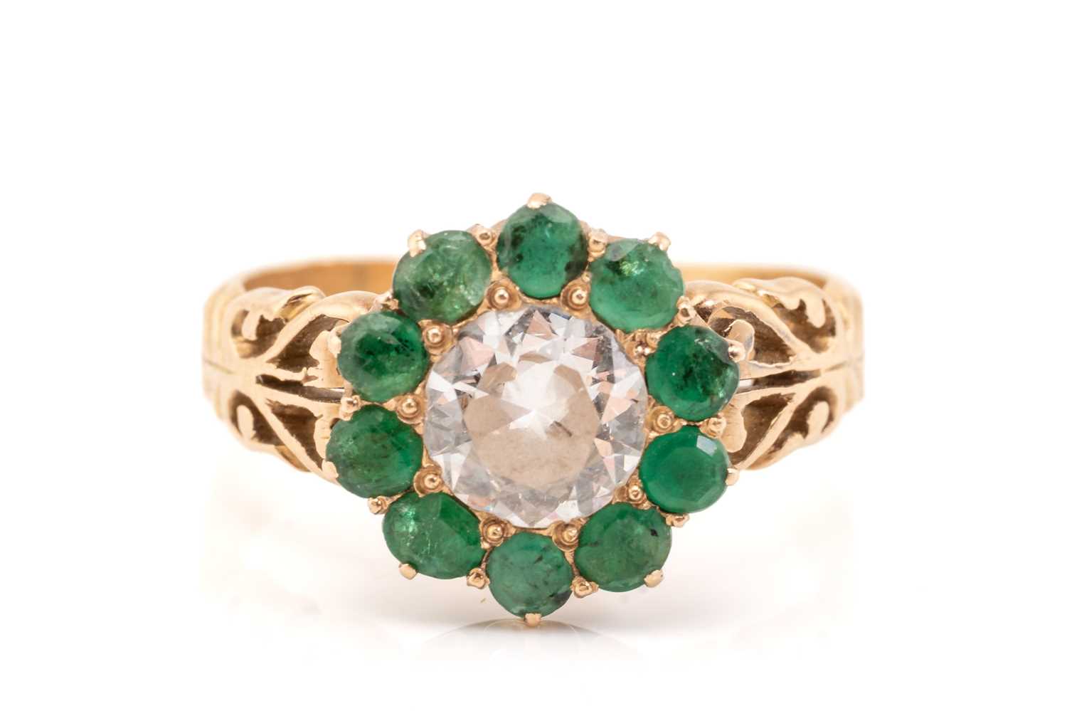 Lot 199 - A yellow metal, diamond and emerald cluster...