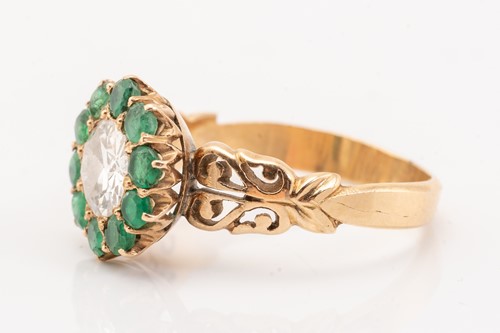 Lot 199 - A yellow metal, diamond and emerald cluster...