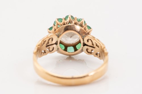 Lot 199 - A yellow metal, diamond and emerald cluster...
