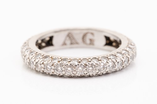 Lot 200 - A white metal and diamond full eternity ring,...
