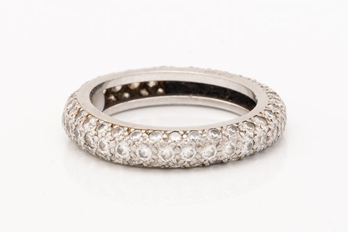 Lot 200 - A white metal and diamond full eternity ring,...