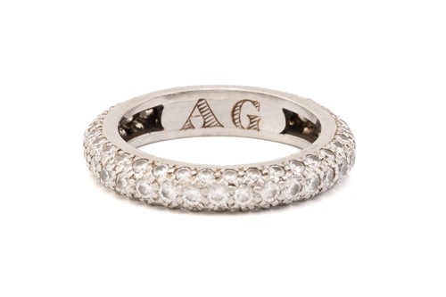 Lot 200 - A white metal and diamond full eternity ring,...