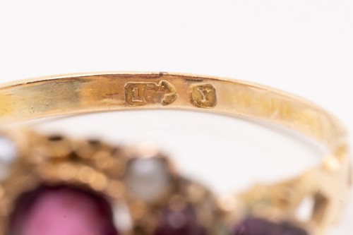 Lot 68 - A Victorian gem-set ring featuring a central...