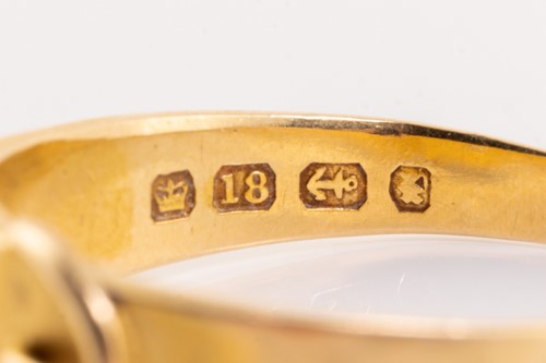 Lot 9 - An 18ct gold diamond-set ring, of buckle...