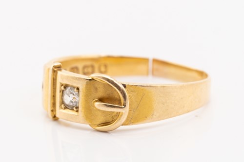 Lot 9 - An 18ct gold diamond-set ring, of buckle...