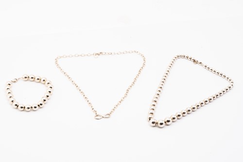 Lot 127 - Tiffany & Co. A silver graduated ball necklace,...