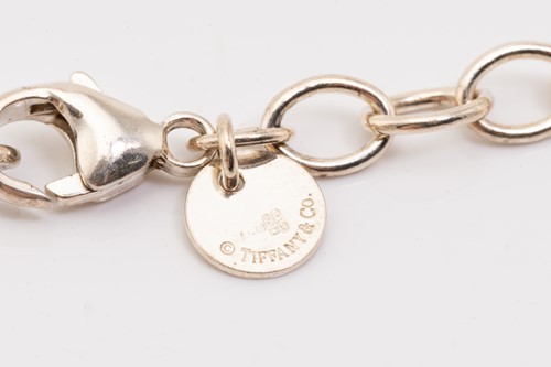 Lot 127 - Tiffany & Co. A silver graduated ball necklace,...
