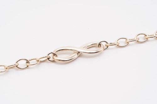 Lot 127 - Tiffany & Co. A silver graduated ball necklace,...