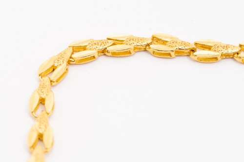 Lot 236 - A fancy chain necklace, comprising flat rolled...