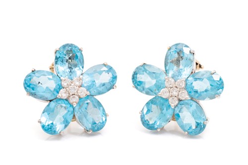 Lot 124 - A pair of flowerhead earrings set with topaz...