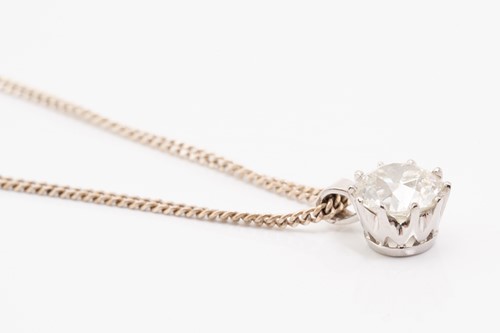 Lot 290 - A solitaire diamond pendant, the Old European...