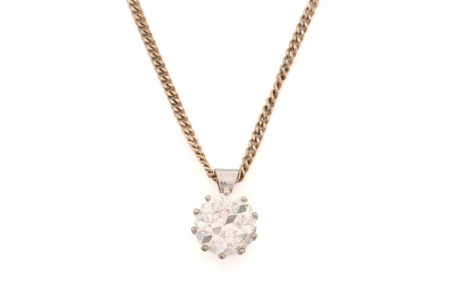 Lot 290 - A solitaire diamond pendant, the Old European...