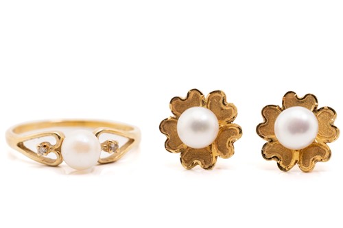 Lot 222 - A pair of pearl stud earrings and a dress ring;...