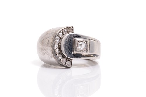 Lot 195 - An Art Deco diamond dress ring; in a stylised...