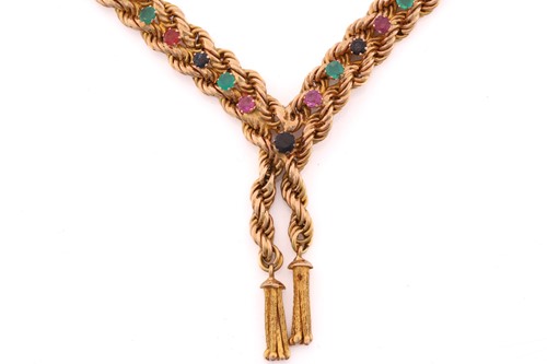 Lot 199 - A lariat-styled necklace set with gemstones,...