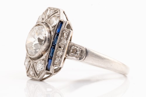 Lot 20 - An Art Deco diamond sapphire panel ring,...