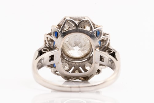 Lot 20 - An Art Deco diamond sapphire panel ring,...