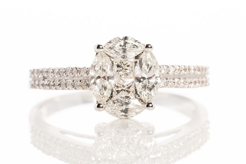 Lot 234 - A diamond cluster ring in 18ct white gold,...