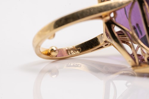 Lot 8 - A large amethyst cocktail ring, featuring a...