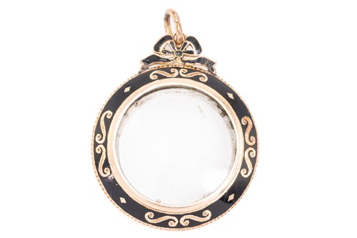 Lot 105 - A mourning locket pendant, the circular locket...