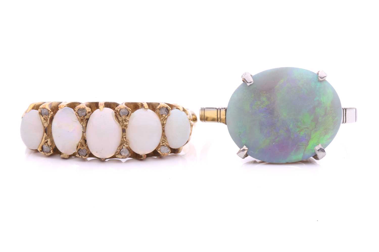 Lot 34 - Two precious opal dress rings; to include a...