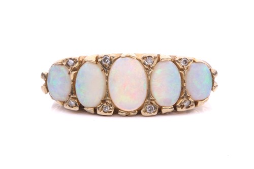 Lot 216 - A five-stone opal half-hoop ring in 9ct gold,...