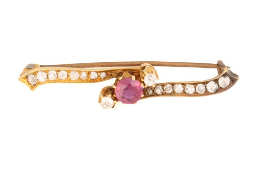 Lot 146 - A ruby and diamond bar brooch, featuring a...