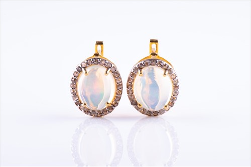 Lot 431 - A pair of silver gilt, diamond, and opal...