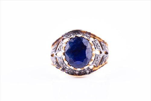 Lot 430 - An unusual silver gilt and blue gemstone...