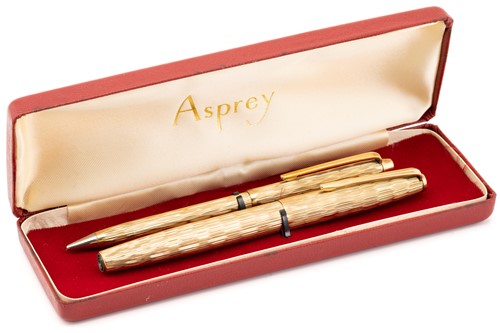 Lot 340 - Asprey. A cased 9 carat gold ball point pen...