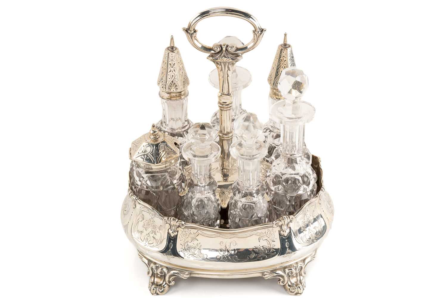 Lot 536 - A Victorian silver seven-bottle table cruet,...