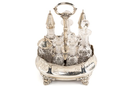 Lot 536 - A Victorian silver seven-bottle table cruet,...